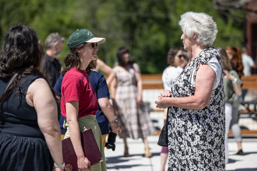 Chronicle columnist Maureen Harkcom, right, speaks with Congresswoman Marie Gluesenkamp Perez during a grand opening for the Agriculture Innovation Park in Tenino on Wednesday, May 28.