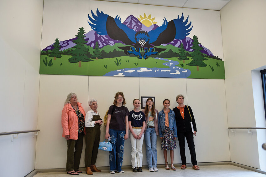 From left to right, middle school students Isabela Hodston, Amelia Benson, Stella Lindsay and Delilah Higgins stand with members of the La Center Arts Council in front of the completed mural. Students Mya Cluphf and Eunice Sparks, not pictured, also contributed to the project.