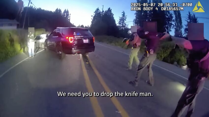 This screenshot from Kitsap County Sheriff&rsquo;s Office body camera footage shows the moments before law enforcement killed Justin Moegling near Poulsbo last month. (Kitsap County Sheriff&rsquo;s Office)