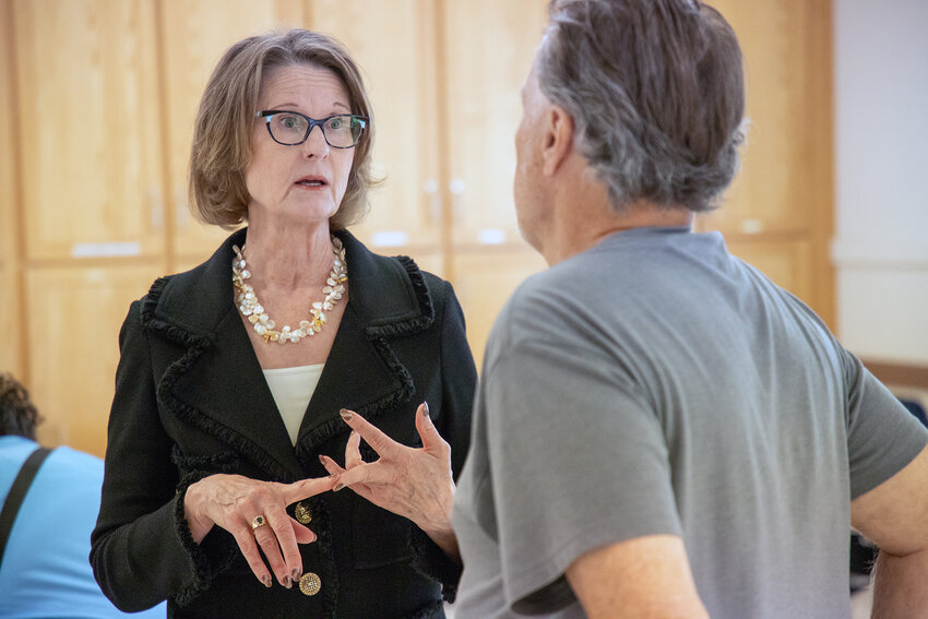Washington state Insurance Commissioner Patty Kuderer chats with Chehalis Mayor Tony Ketchum on Tuesday, June 17, at the Twin Cities Senior Center during a community outreach event.