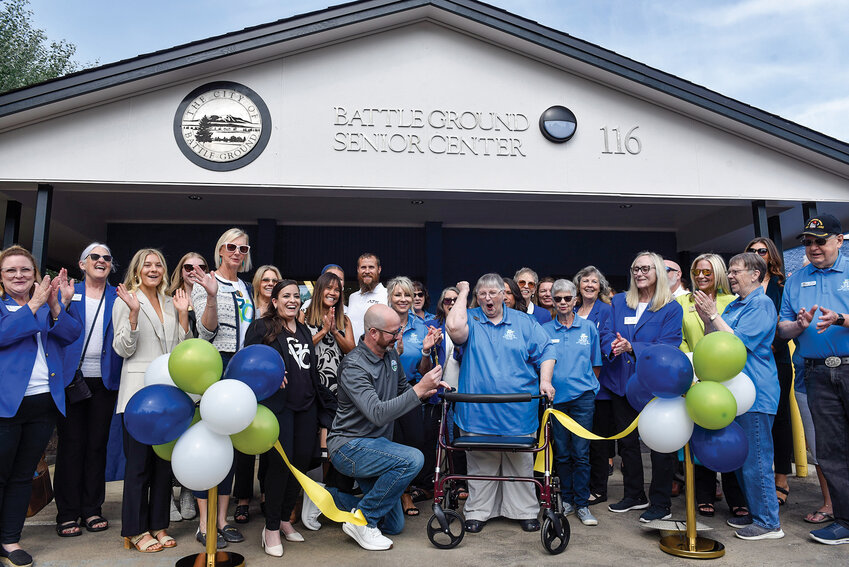 Mayor Troy McCoy cuts the ribbon alongside Battle Ground Senior Citizens Inc. (BGSC) President Sharon Wodtke on June 16. The remodeled Battle Ground Senior Center will open in early July.