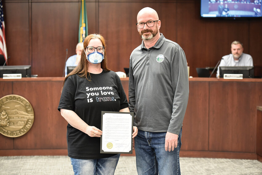 Battle Ground Mayor Troy McCoy (right) takes a photo with Jessica Cole holding the proclamation she helped develop following the City Council meeting on Monday, June 16. The proclamation, recognizing June as Pride Month, was issued without objection one year after it was blocked by a minority vote.