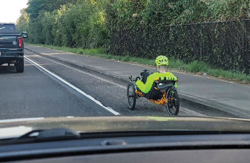 A person utilizing a recumbent tricycle in the narrow bike lane along southbound state Route 503 in Battle Ground on Sunday, June 15, consistently rode back and forth towards the white line, creating a traffic hazard as cars passed by at 55 miles per hour.