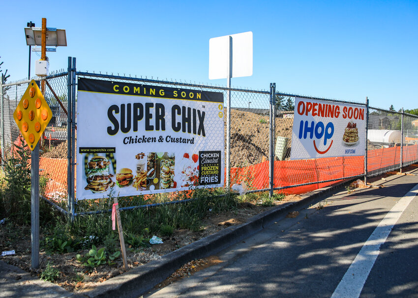 Signs for two upcoming corporate chain restaurants, Super Chix and IHOP, are now along Southwest Scotton Way as the foundations for the two eateries have been poured into the Scotton Landing development in Battle Ground.