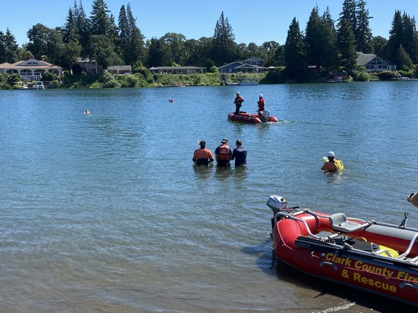 First responders at Horseshoe Lake, where a body was recovered on Monday, June 30 in Woodland.