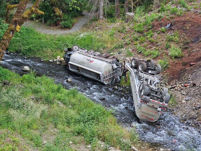 A fuel truck is seen overturned in Indian Creek in the Elwha River watershed after it crashed on Friday, July 18, 2025, near Port Angeles. (Photo courtesy of Clallam 2 Fire-Rescue)