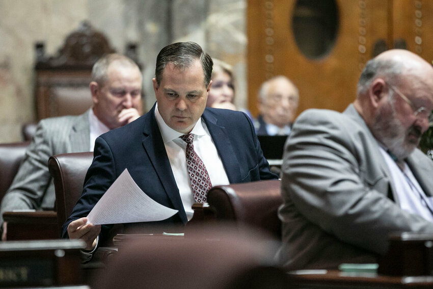 Sen. John Braun, R-Centralia, looks through documents during the legislative session at the Washington state Capitol in Olympia on Friday, April 25.