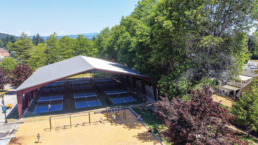 Players rally beneath the metal roof at the Kiwanis Park pickleball courts in Battle Ground on Thursday, April 30. A city-commissioned study conducted late last year found the roof structure contributes to noise carrying into nearby neighborhoods.