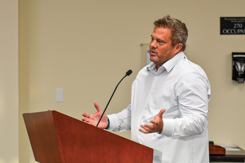Dr. Conway Jensen, a pediatric dentist who has practiced in Battle Ground for 17 years, addresses the council during public comment on July 21. He urged the city to keep fluoride in the water, citing its benefits for children's dental health.