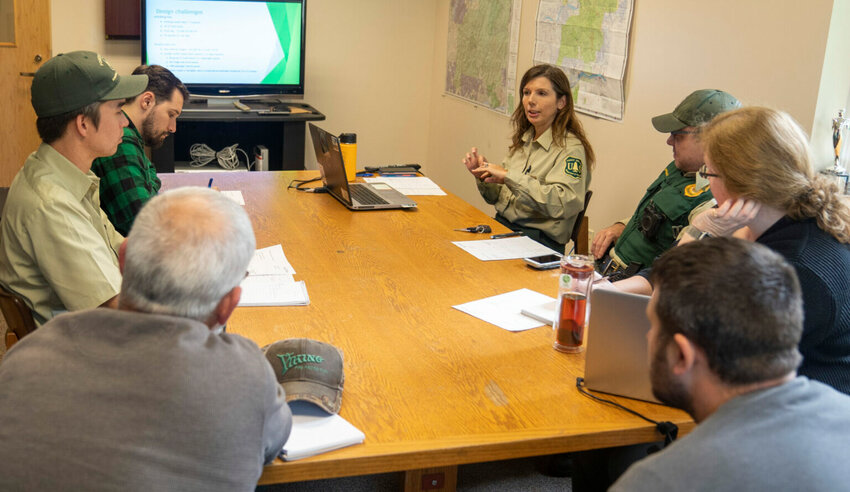 Monument Ranger Rebecca Hoffman (top right) and her staff at a meeting on Sept. 23, 2019 at Mount St. Helens National Volcanic Monument in the Gifford Pinchot National Forest in Washington. The forest is part of the U.S. Forest Service Region 6, who will lose its regional headquarters under a new plan from the U.S. Department of Agriculture. (Photo courtesy of USDA /Cecilio Ricardo)