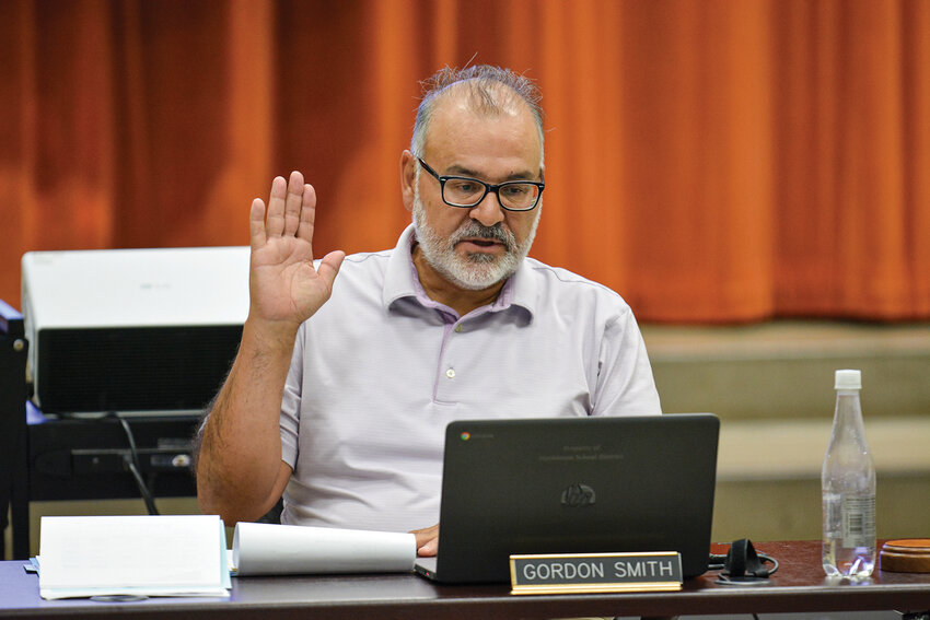 Hockinson School Board member Gordon Smith joins in the unanimous vote to approve the 2025-26 district budget on Monday, July 28. The board adopted a $36.39 million general fund budget that includes staffing cuts and reduced building budgets due to lower-than-anticipated enrollment.