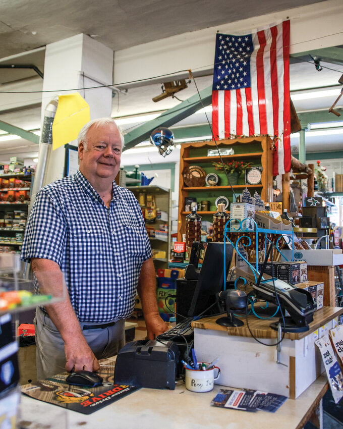 Scott Hughes, owner of Ridgefield Hardware and Gift since 1999, stands behind the counter on the morning of Thursday, Aug. 7. Hughes made the decision to permanently close the store at the end of September in order to be able to spend more time with his wife, Cathy, as she has fallen ill.