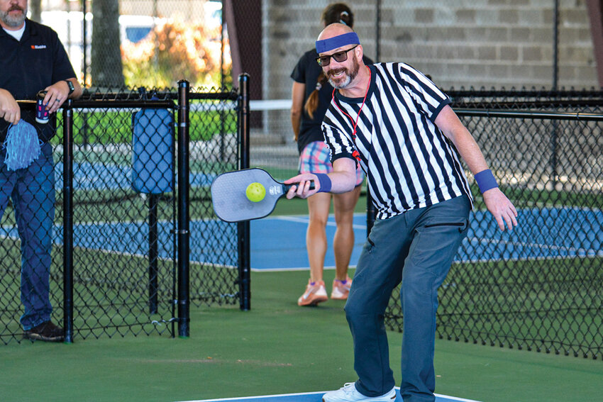 Mayor Troy McCoy relays a ball during the city&rsquo;s pickleball kickoff match Aug. 5 at Kiwanis Park. The event followed a belated ribbon-cutting for the city&rsquo;s new pickleball facility, which opened in July.