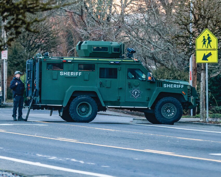 A Clark County Sheriff&rsquo;s SWAT vehicle sits outside of a home in Battle Ground in February.