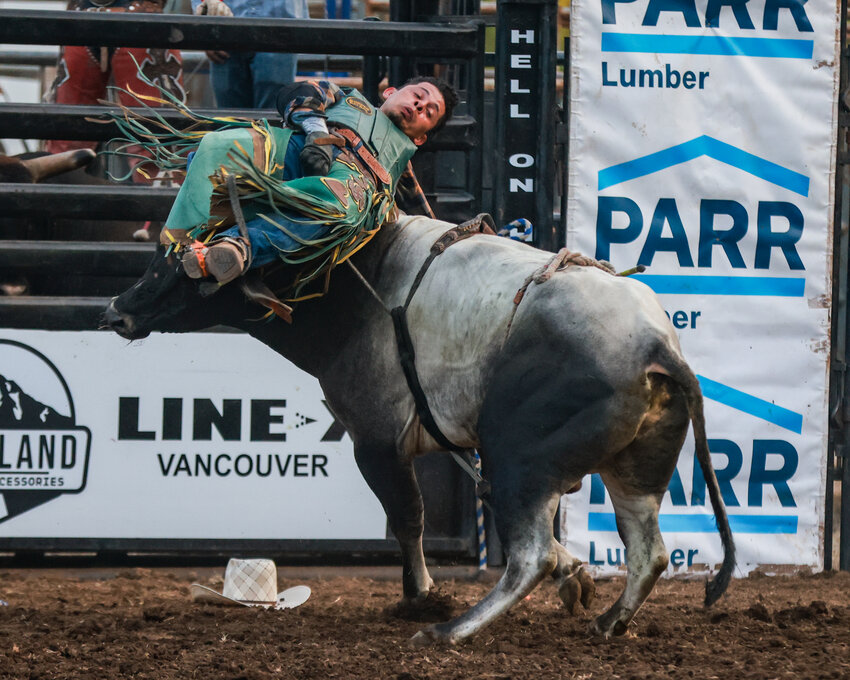 Bull riding proved to be hard hitting when a rider was struck in the middle of the back after being bucked off, but he walked away from the hit during the Hell on Hooves Roughstock Rodeo at the Clark County Fair on Tuesday, Aug. 6.