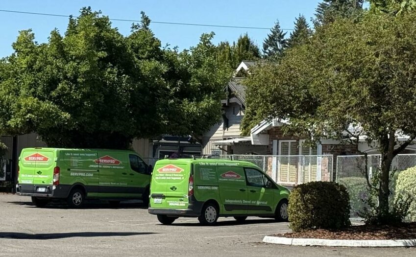Two fire and restoration vehicles sit parked outside Stuffy's II restaurant in Longview Wednesday afternoon. Owners say they remain committed to reopening and caring for its roughly 35 employees after an Aug. 4 fire and an Aug. 12 appellate court opinion determining that $936,000 in fines for staying open during COVID shutdowns was not excessive.