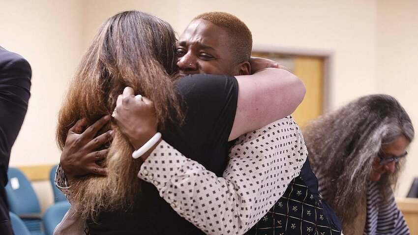 North Idaho drag performer Eric Posey hugs a supporter in May 2024 after winning $1.1 million in a defamation suit against a local blogger who accused him of exposing himself.