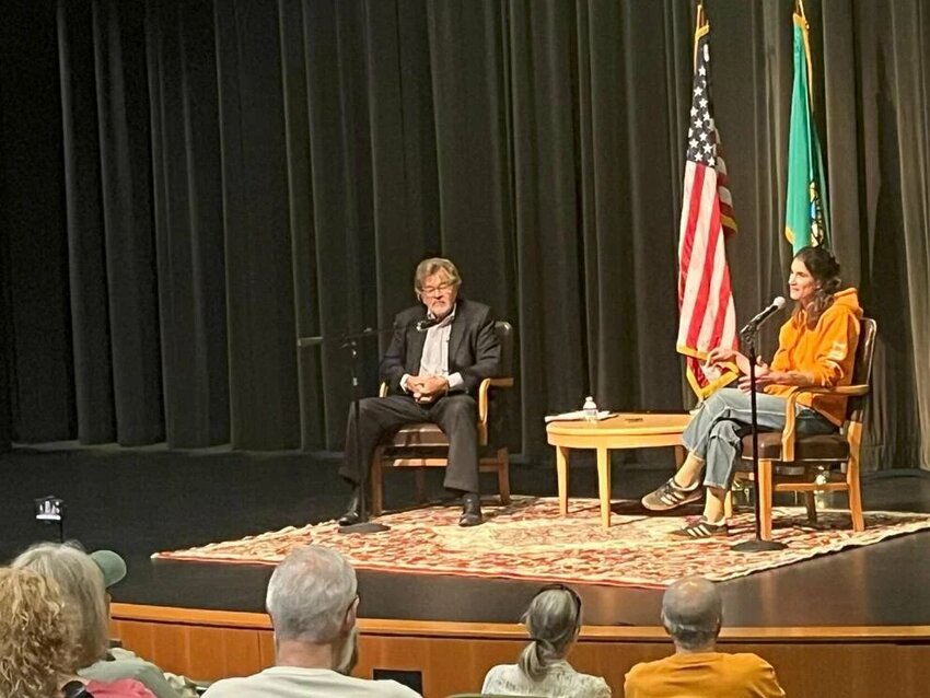 Former Cowlitz County Superior Court Judge Stephen Warning, left, moderates a town hall with U.S. Rep. Marie Gluesenkamp Perez at Lower Columbia College Thursday, Aug. 14. Several audience members were escorted out after shouting at Gluesenkamp Perez over her support for Israel.