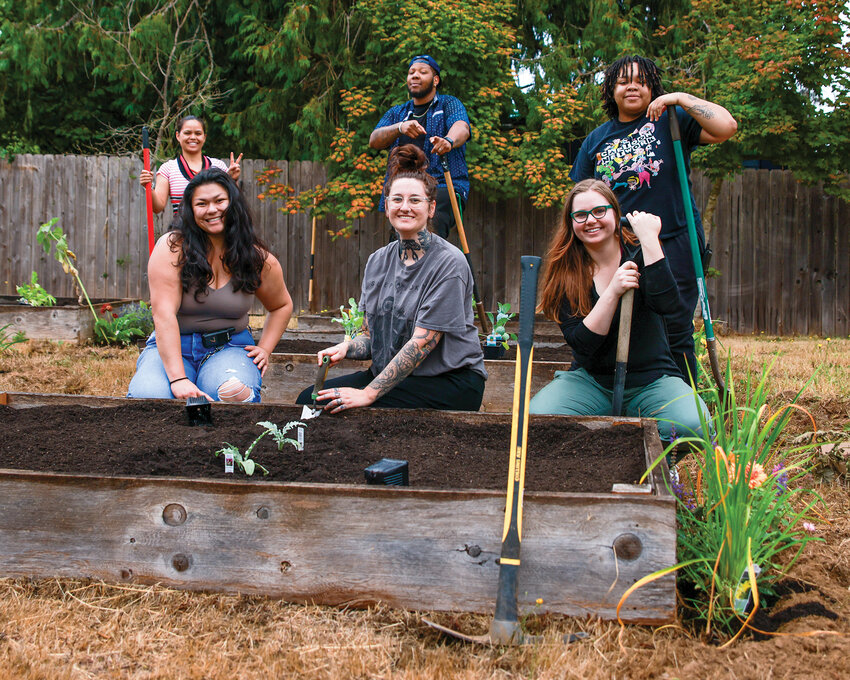 Madrona Recovery guidance counselors work on the garden at Madrona&rsquo;s new facility in Brush Prairie on Friday, Aug. 15, ahead of its opening later this month. Staff, from back left to lower right, include Jen Sena, Dez Robinson, Kiannah Green, Lexi Tupuola, Kenzie Robinson and Kaysa Pfannmuller.