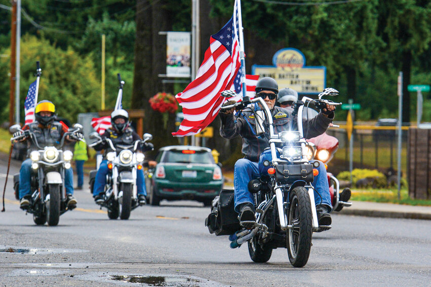 Motorcycles rumble down North Amboy Road during the Windhaven Ride for Veterans on Saturday, Aug. 16. The annual ride raises money for the Windhaven Veterans Program, a service under Lifeline Connections&rsquo; Healing Animal Partners Program, providing equine-assisted therapy that helps veterans living with PTSD.