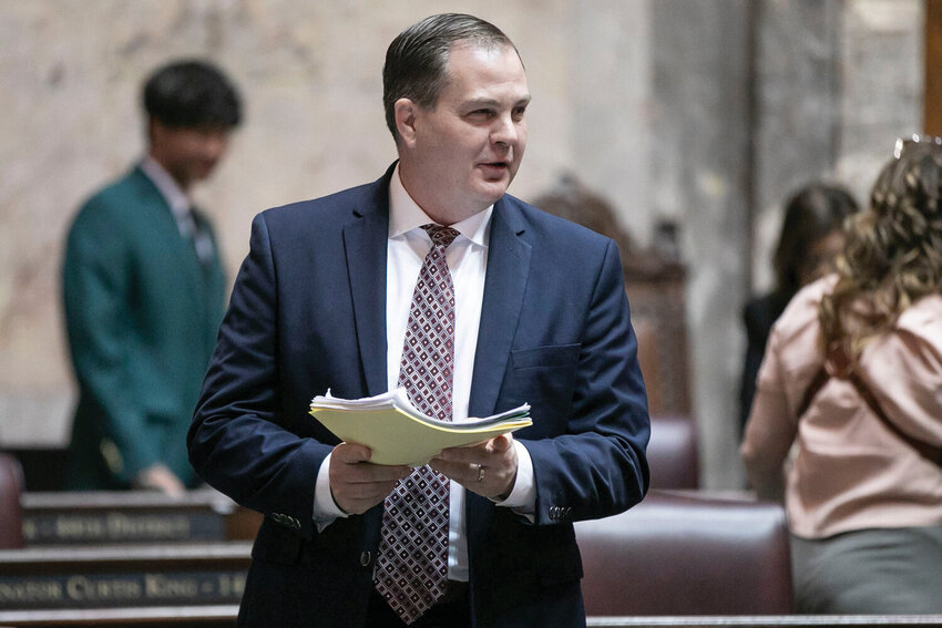 Sen. John Braun, R-Centralia, speaks with other senators  during the legislative session at the Washington state Capitol in Olympia on Friday, April 25.