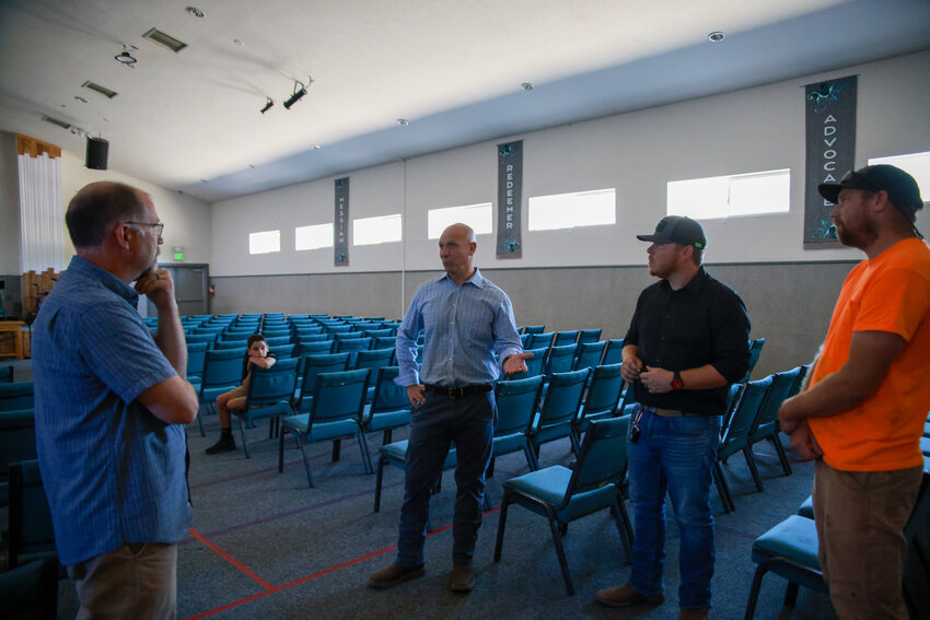 State Rep. Peter Abbarno, R-Centralia, speaks with Yacolt community leaders regarding topics related to creating a community center while at the Yacolt Community Church facility during a tour of the town on Tuesday, Aug. 12.