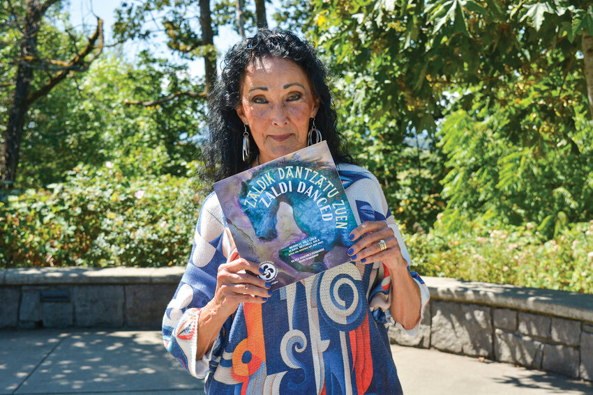 Merrilee Asla Lee holds a copy of her and her brother&rsquo;s recently published book, &ldquo;Zaldi Danced.&rdquo; The bilingual children&rsquo;s book reflects her Basque heritage and tells a &ldquo;might-have-been&rdquo; tale of the Basque ancestors&rsquo; creation story.