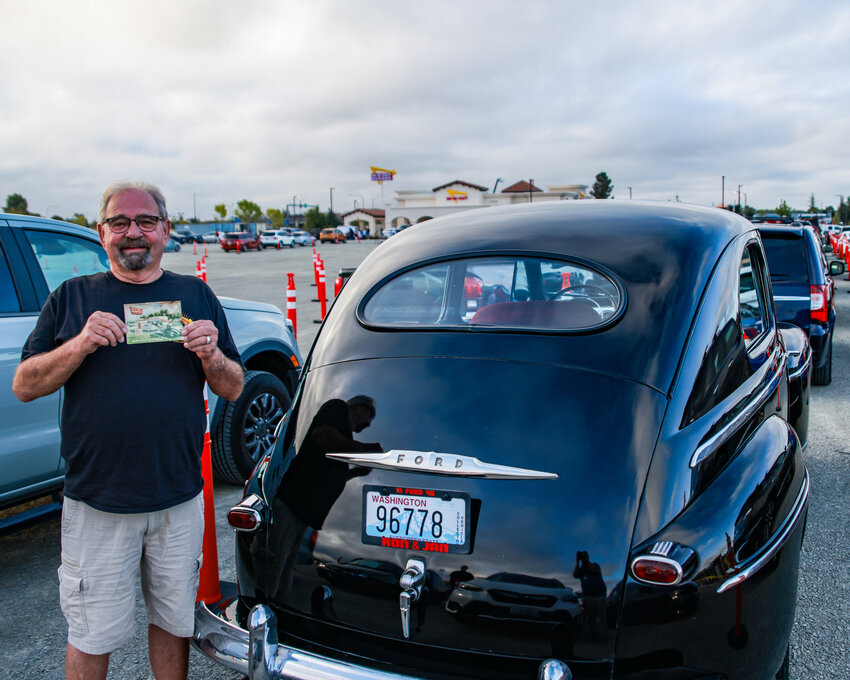 Ron Burby, of Vancouver, the winner of the In-N-Out Burger 1992 bumpersticker sweepstakes, was about 30th in line in his 1946 Ford. Burby won 100 free burger certificates in 1992 and brought the final one with him to donate to In-N-Out's CEO Lynsi Snyder for the historical aspect of one of the very few, if not the only, remaining certificates.