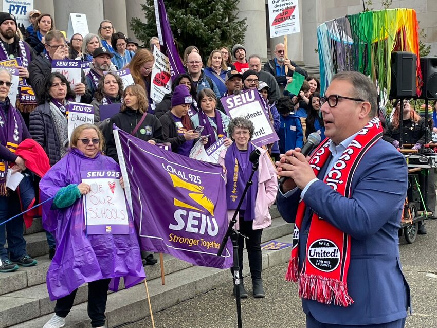 Washington state Sen. Adrian Cortes speaks to hundreds of teachers, school employees and students on Feb. 17, 2025 at the Washington state Capitol. Cortes will speak at a solidarity rally for striking Evergreen Public Schools classified employees on Sept. 1. (Jerry Cornfield/Washington State Standard)