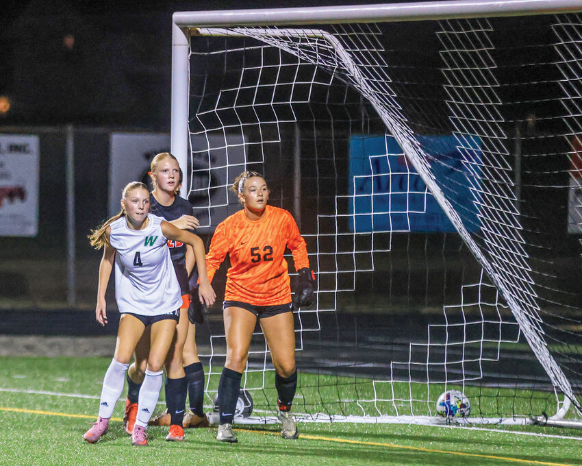 Woodland&rsquo;s Ruby Ingle, no. 4, battles for position during a corner kick with Battle Ground goalkeeper Camille Cresap, no. 52, and Claire Clark during the closing minutes of Battle Ground&rsquo;s 1-0 win on Thursday, Sept. 4.