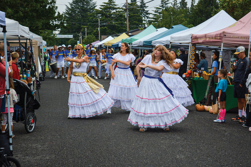 Samba dancers lead a parade down Main Avenue on Saturday, Sept. 6, as Portland Samba performs. The parade was part of the Ridgefield Multicultural Festival&rsquo;s celebration of global traditions.