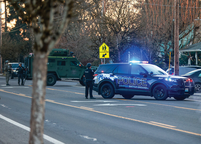 The Battle Ground Police Department and Southwest Washington Regional SWAT Team work together on an incident in Battle Ground in February. The case involving a residence on North Parkway Avenue in Battle Ground also had other incidents where the Portland Police Bureau&rsquo;s Aviation Unit assisted with its fixed-wing aircraft.