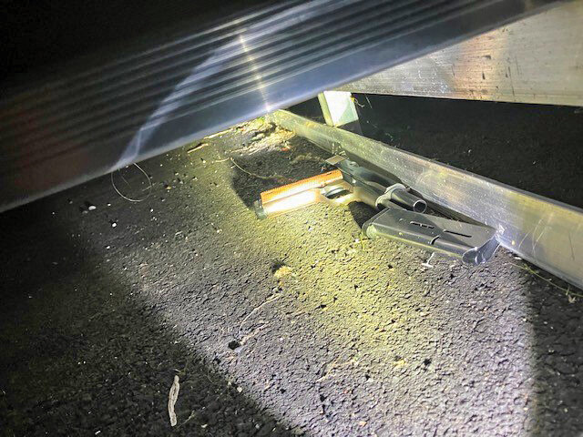 A stolen firearm lies beneath the bleachers at Heritage High School, where deputies recovered it. The weapon was used by a 17-year-old juvenile who allegedly fired multiple rounds during an attempted car prowl early Friday morning.