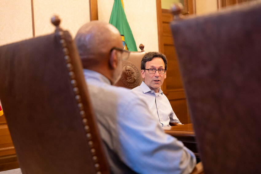 Washington Gov. Bob Ferguson signed an executive order Sept. 3 creating Your Washington, a division of the executive branch that will focus on improving how the state delivers services to residents. Jesse Jones, the director, speaks with Ferguson after the signing. (Photo courtesy of governor&rsquo;s office.)