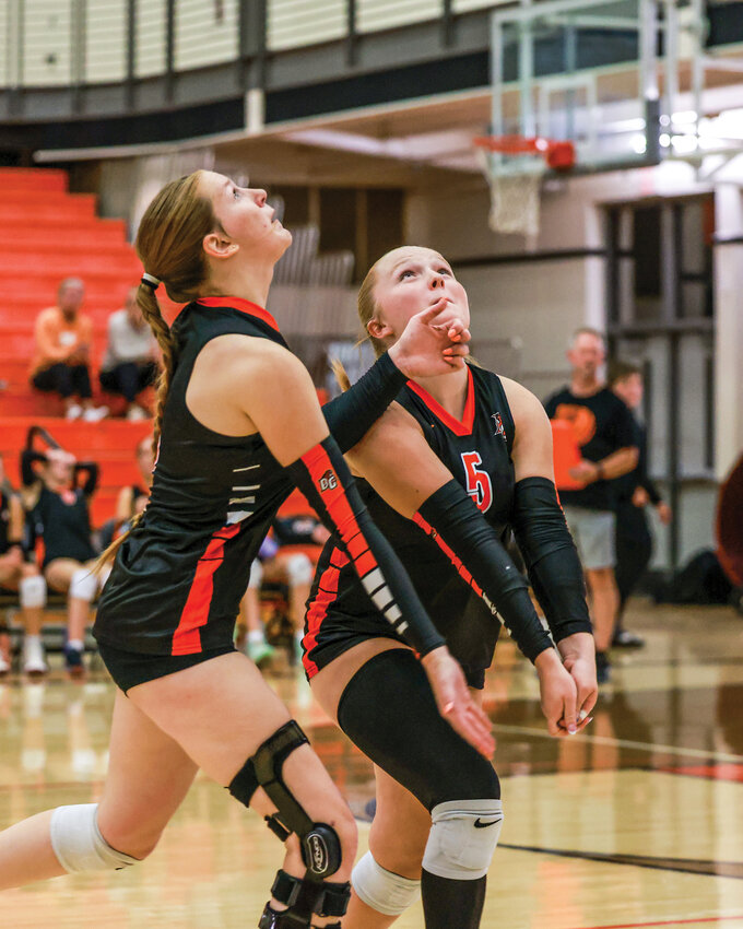Battle Ground volleyball players Audrey Joner, left, and Riley Hurliman go for a ball in the Tigers&rsquo; 3-1 loss to Columbia High School on Wednesday, Sept. 10.