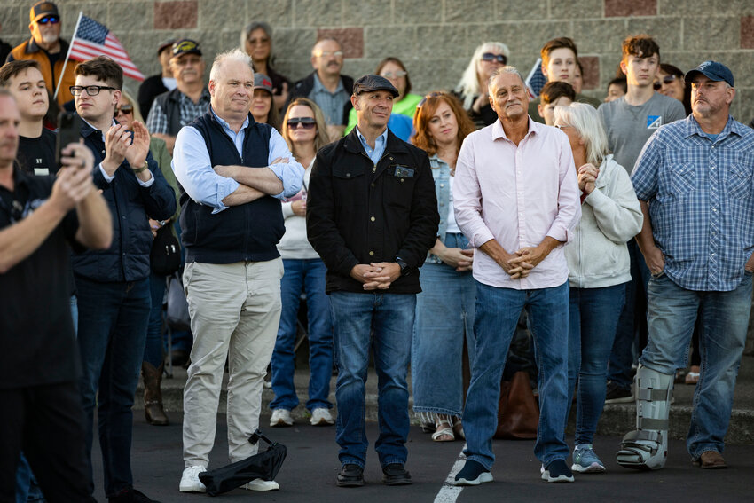 From the left, Rep. Jim Walsh, Rep. Peter Abbarno and Sen. Jeff Wilson stand together during a vigil to mourn conservative activist Charlie Kirk at the Veterans Memorial Museum in Chehalis on Sunday, Sept. 14.
