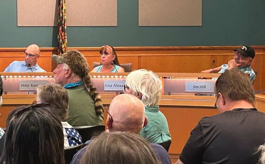 Councilmember Jim Hill, far right, listens to commenters speaking against him at the Tuesday, Sept. 16 Kelso City Council meeting.