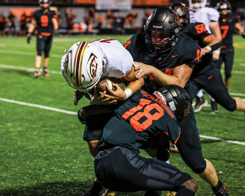 Battle Ground cornerback Trent Richardson makes a tackle during the Tigers&rsquo; 41-6 win over rival Prairie High School on Friday, Sept. 19.
