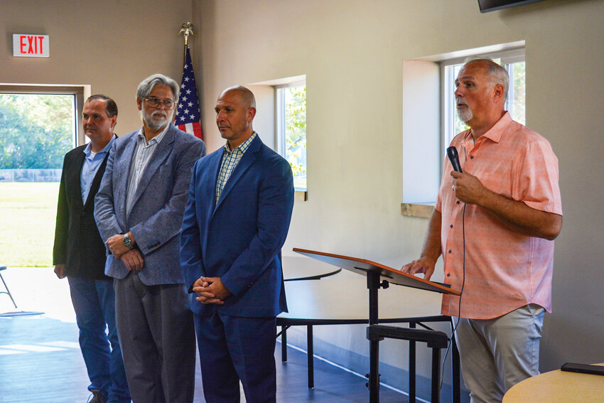 La Center Mayor Tom Strobehn, right, speaks to community members on Sept. 16. Standing next to him, from left to right, are Sen. John Braun, Rep. Ed Orcutt and Rep. Peter Abbarno. The city honored the legislators for their role in funding improvements to the Wheel Club Community Center.