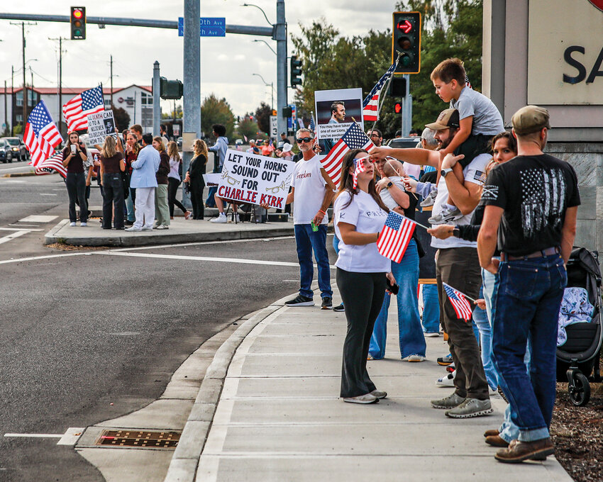 North Clark County community members gathered in Battle Ground at state Route 503 and Main Street for a flag waving event in remembrance of Charlie Kirk on Sunday, Sept. 21.