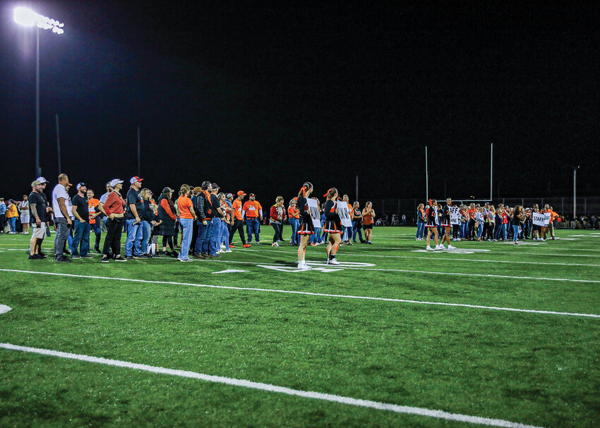 Battle Ground and Prairie high school current and former staff and alumni are honored during halftime of the rivalry football game at District Stadium on Friday, Sept. 19.
