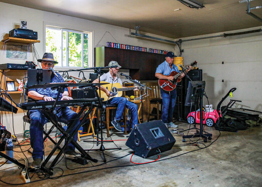 The Dove Creek band practices in Rick Narhi's garage near Battle Ground on Tuesday, Sept. 16. The band consists of Phil Badalamenti, left, Narhi, center and Dave Palodichuk.