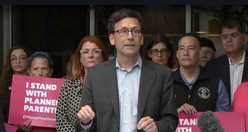 Washington state Gov. Bob Ferguson speaks out against the One Big Beautiful Bill Act during a news conference in Seattle.