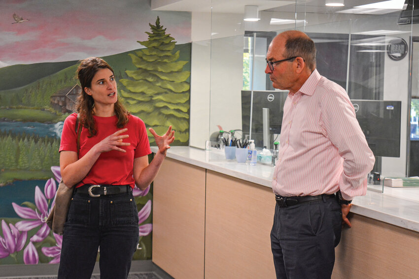U.S. Rep. Marie Gluesenkamp Perez speaks with Clark County Auditor Greg Kimsey in the lobby of the Clark County Elections Office on Wednesday, Sept. 24. The congresswoman toured the facility and vowed to defend Washington&rsquo;s vote-by-mail system against efforts made by the Trump administration to restrict it.
