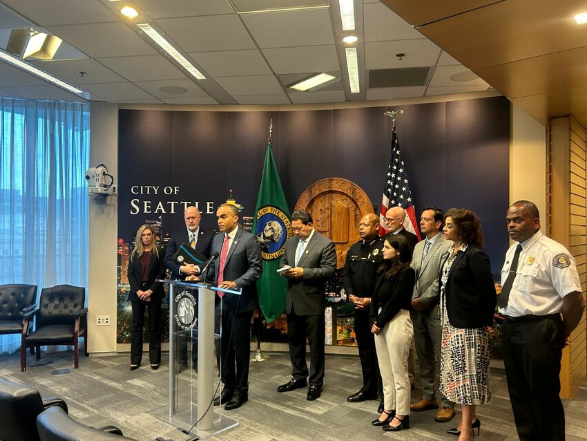 Washington state Attorney General Nick Brown speaks at a press conference alongside Seattle Mayor Bruce Harrell and other local officials on Monday, Sept. 29, 2025, at Seattle City Hall.