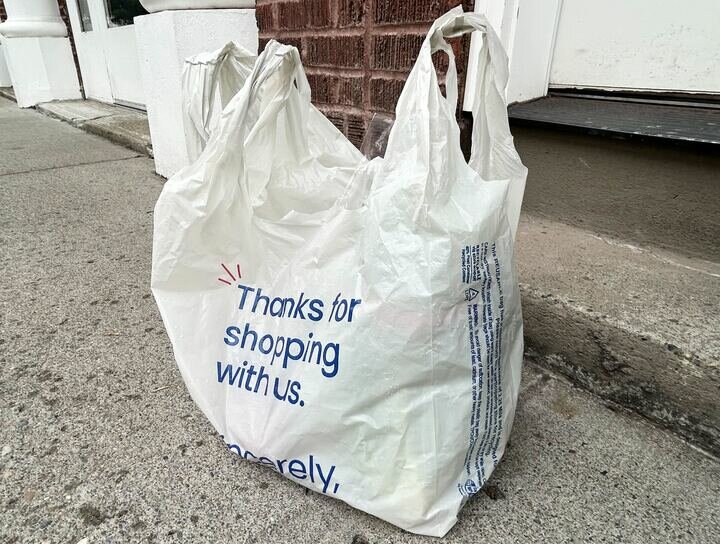 A 2.25-millimeter thick reusable plastic grocery bag. Each bag is intended to last up to 125 uses. (Photo by Emily Fitzgerald/Washington State Standard.)