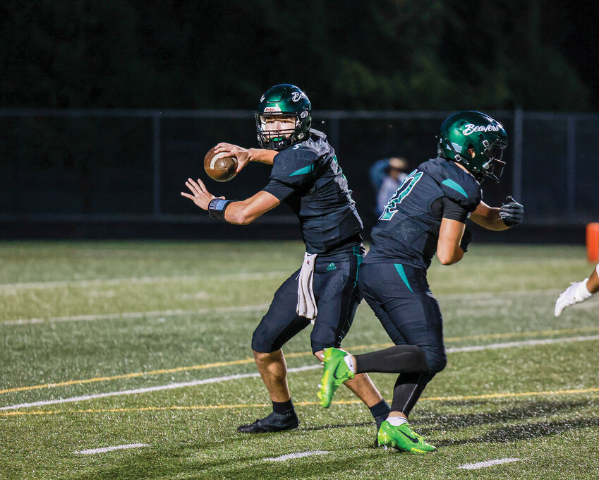 Woodland quarterback Michael Belvin sets up to throw a screen pass in the Beavers&rsquo; 27-7 win over the Hockinson Hawks on Friday, Oct. 3.