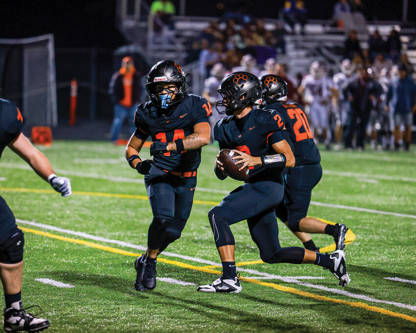 Battle Ground Tigers quarterback Ethan Adams, No. 2, executes a play-action touchdown pass in the Tigers&rsquo; 28-24 loss to the W.F. West Bearcats on Friday, Oct. 10.