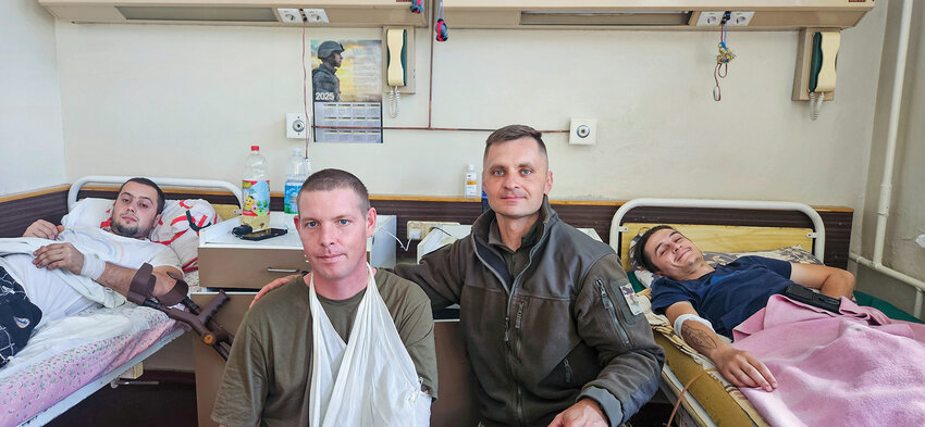 During his two-week mission, Clark Public Utilities lineman and military chaplain Mikhail Pavenko visited wounded soldiers in hospitals across southern Ukraine, offering prayer and humanitarian aid.