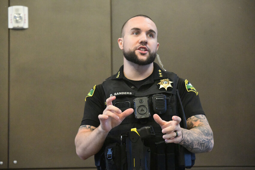 Thurston County Sheriff Derek Sanders addresses the audience in Yelm at his town hall on Wednesday, Oct. 8.